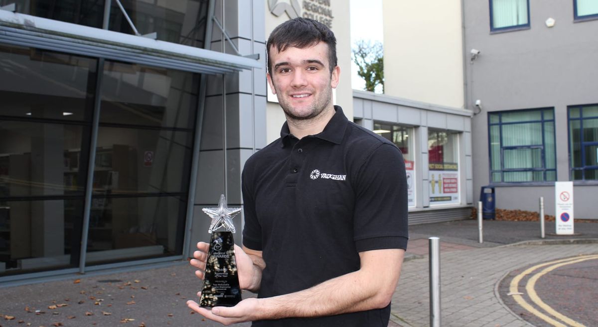 Troy McConville holds his Apprentice of the Year Award outside SERC's Newtownards Campus